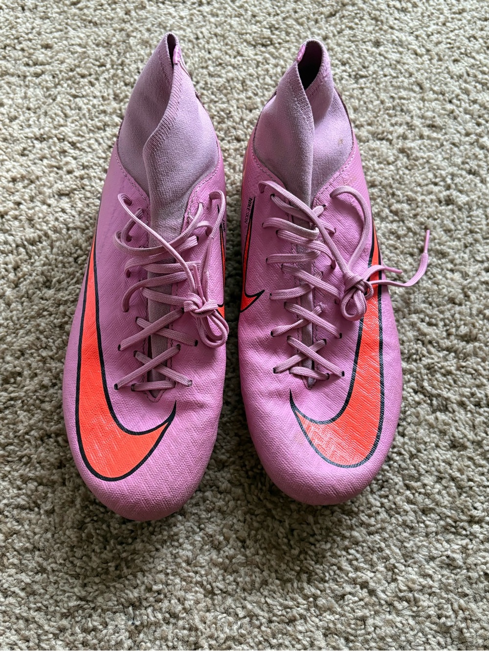 Nike Women's Pink Soccer Cleats with Orange Swoosh Accent